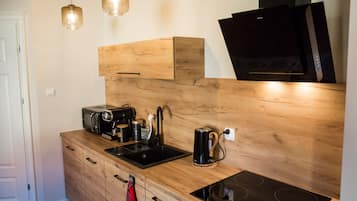 Apartamento exclusivo | Cozinha privada | Frigobar, micro-ondas, cooktop, lava-louças