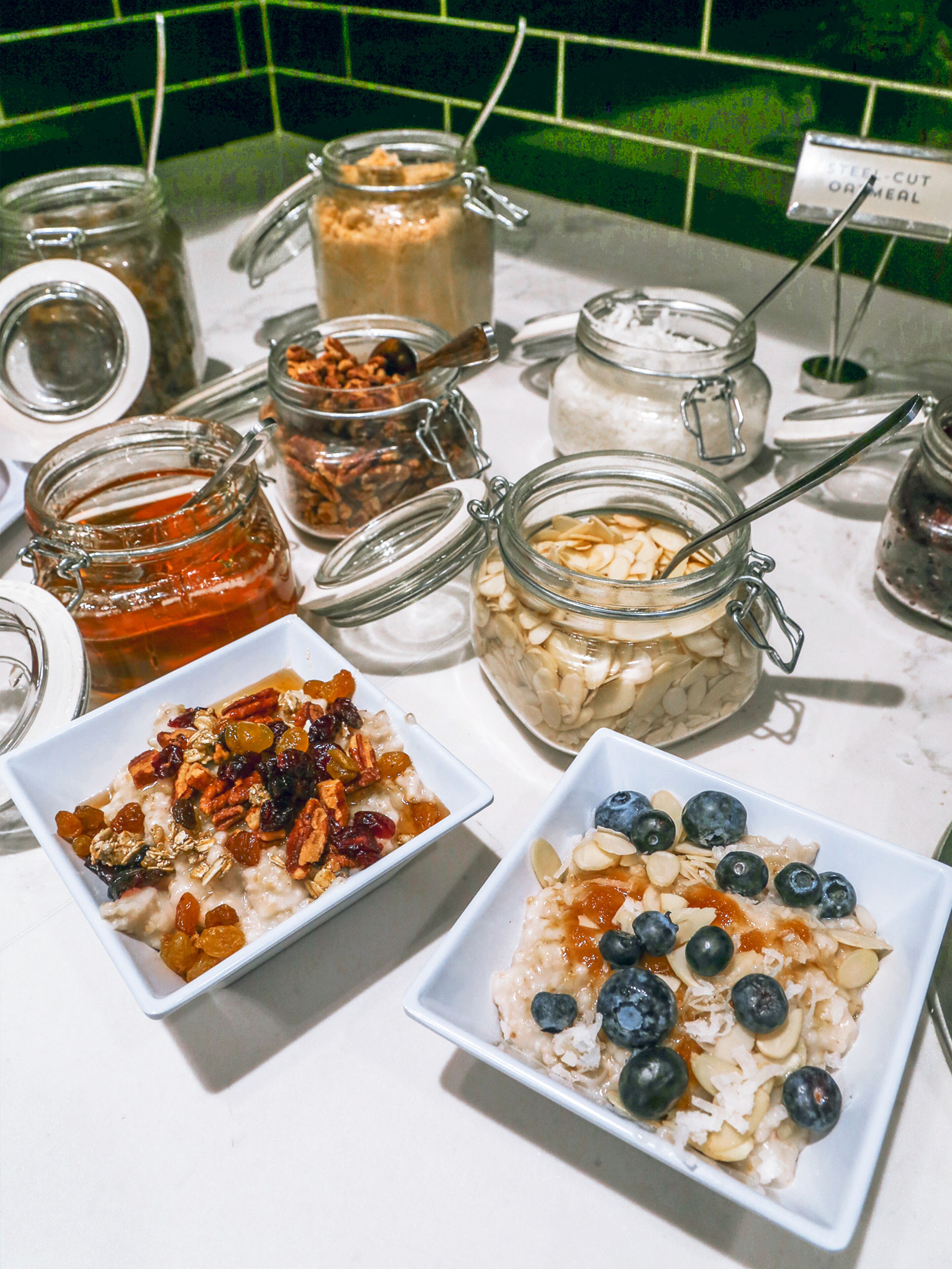 A breakfast buffet with various food items and containers.
