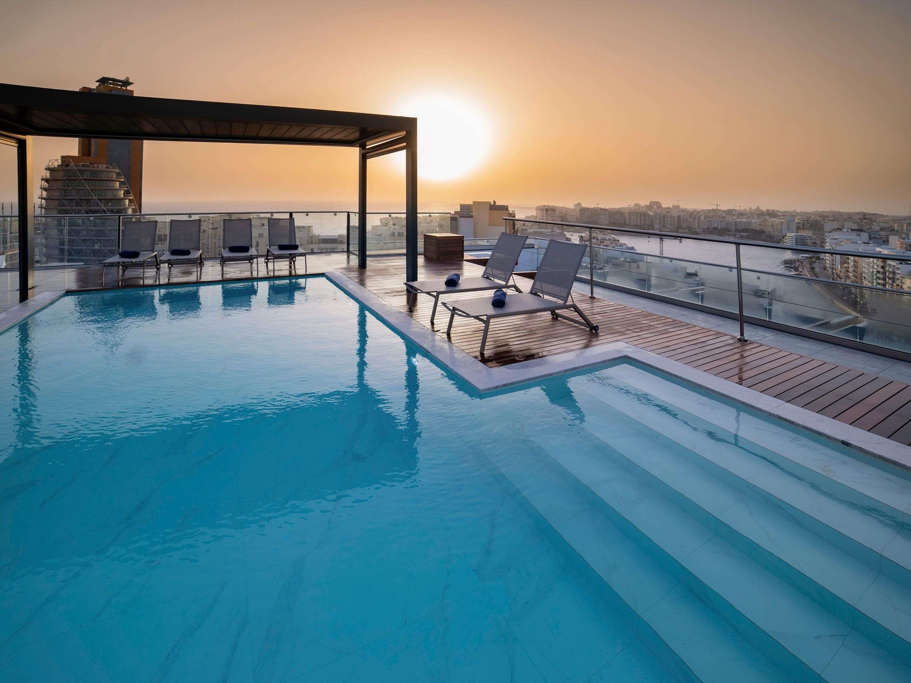 Outdoor pool, pool umbrellas, pool loungers