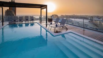 Outdoor pool, pool umbrellas, pool loungers