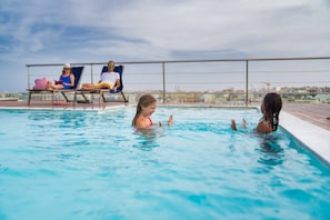 Outdoor pool, pool umbrellas, pool loungers