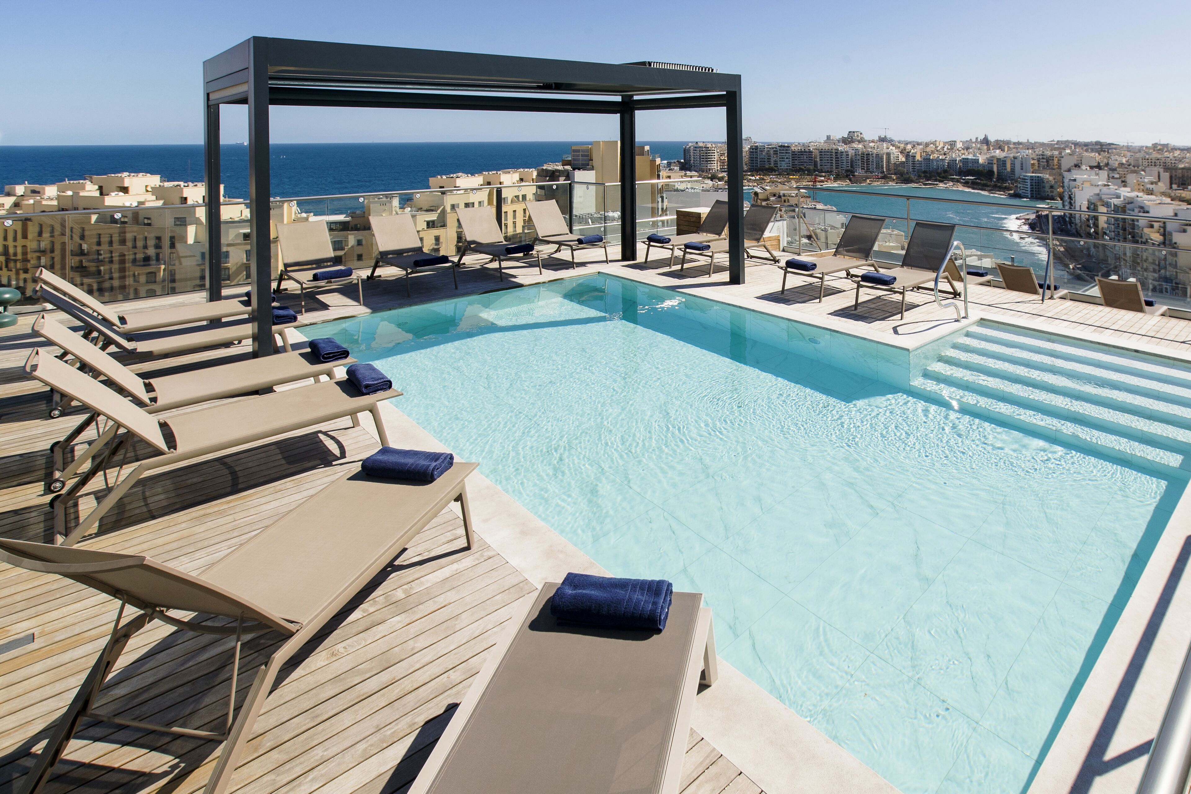 outdoor pool, pool umbrellas, pool loungers