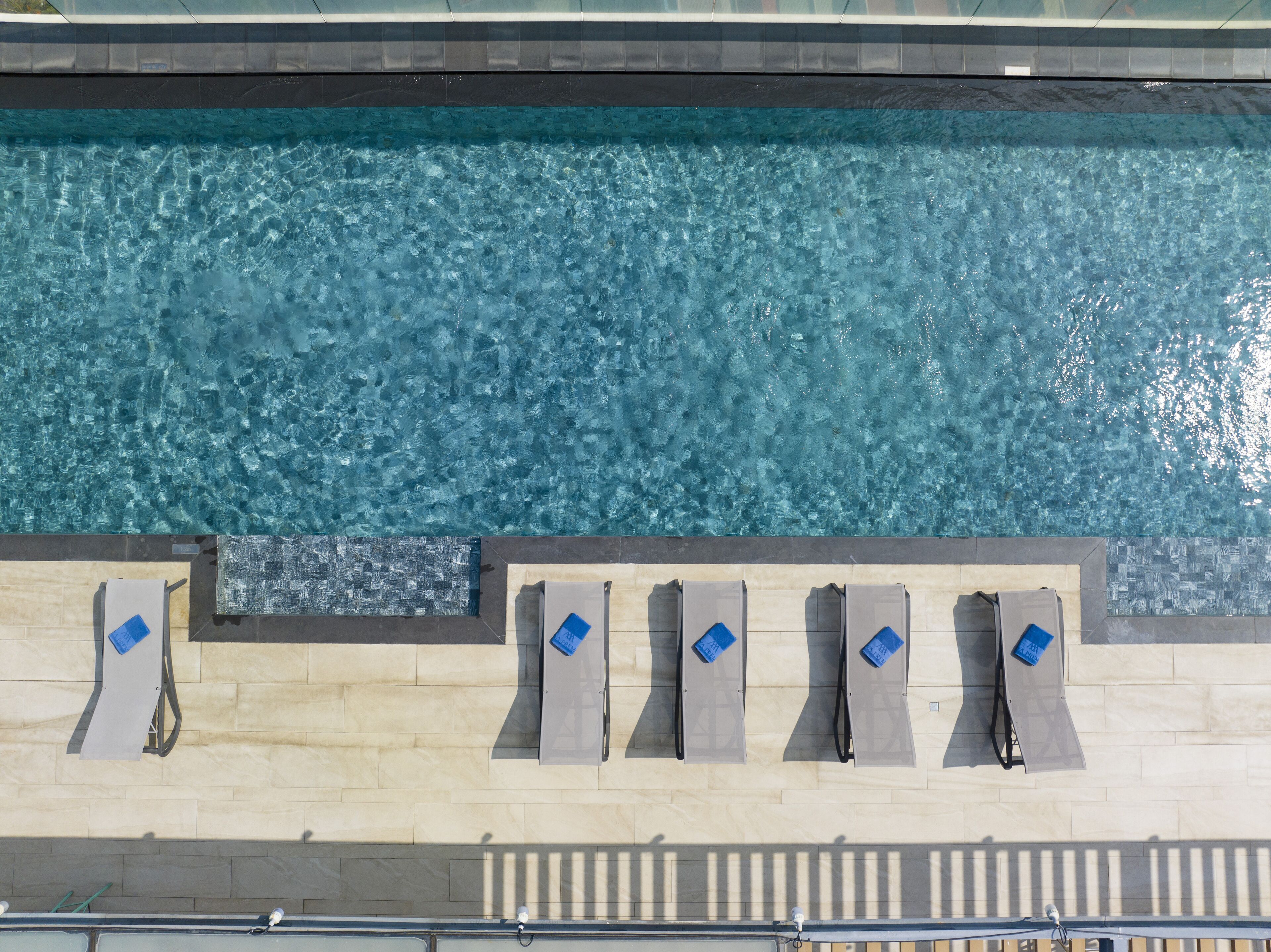 Outdoor pool, open 6:00 AM to 9:30 PM, sun loungers