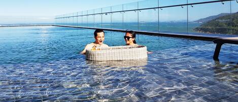 Outdoor pool, open 6:00 AM to 9:30 PM, sun loungers