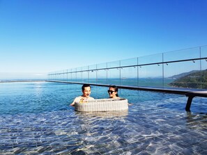 Outdoor pool, open 6:00 AM to 9:30 PM, sun loungers