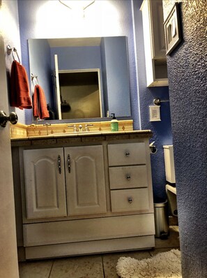 Bathtub, hair dryer, towels, soap