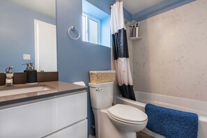 Combined shower/bathtub, hair dryer, towels, soap