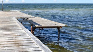 A wooden pier extending into calm waters with a clear sky. - 5 Person Holiday Home in Glesborg-by Traum (Glesborg)