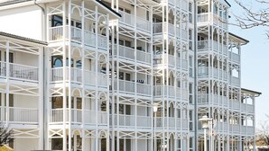 A multi-story building with balconies and large windows. - Holiday Home in Grossenbrode (Grossenbrode)
