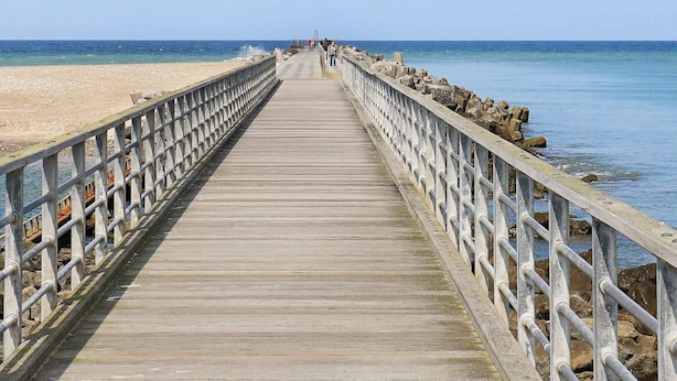 A wooden pier extending into the sea with railings on both sides. - Serene Holidayhome in Thisted near Sea (Thisted)