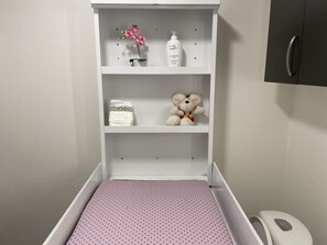 A white cabinet with a pink polka-dotted mat at the bottom. - 5 Star Holiday Home in Spottrup (Spøttrup)