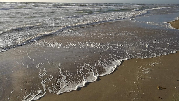 A beach with waves and a clear sky. - 4 Star Holiday Home in Lokken (Lokken)