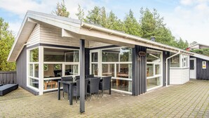 A modern house with a covered patio, large windows, and a number '282' sign. - Secluded Holiday Home in Henne near Beach (Henne)