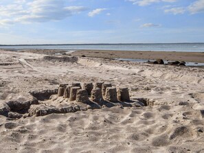 A sandy beach with ancient stone structures. - 6 Person Holiday Home in Glesborg (Glesborg)