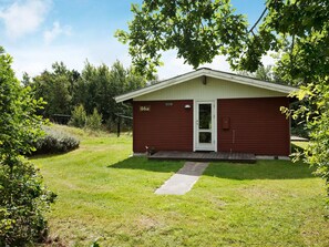 A small, single-story building with a red exterior and a white door, labeled with the number 46a. - Pretty Holiday Home in Ålbæk near Sea (Aalbaek)
