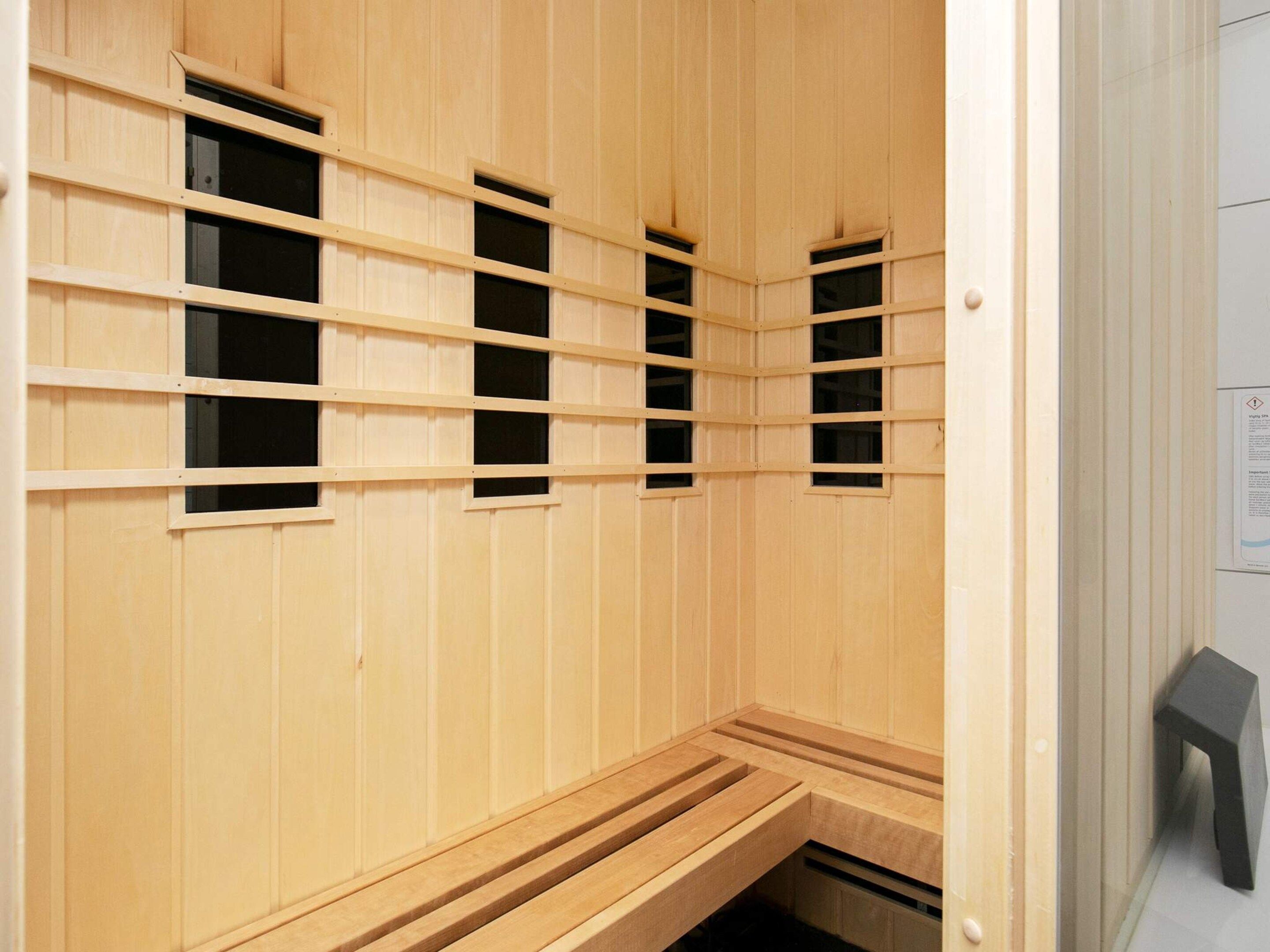 A sauna with wooden walls and benches.