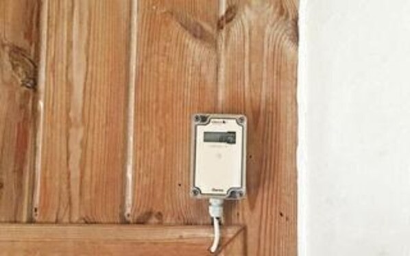 A utility meter mounted on a wooden wall. - 4 Star Holiday Home in Vejers Strand (Vejers Strand)