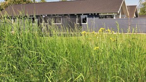 A building with a sloped roof, a visible chimney, and a window. - Luxury Holiday Home in Falster near Sea (Vaeggerlose)