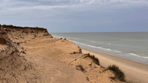 A coastal landscape with a sandy beach and dunes. - Quaint Holiday Home in LÃ¸kken near Beach (Lokken)