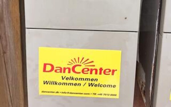 A welcome sign with the text 'DanCenter Willkommen / Welcome' and contact information. - 4 Star Holiday Home in Hemmet (Hemmet)
