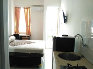 Apartment, 1 Bedroom, Terrace | 1 bedroom, iron/ironing board, bed sheets - 1br Apartment With Pool (Depok)