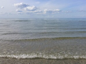A calm sea with gentle waves and a clear sky. - 10 Person Holiday Home in Lokken-by Traum (Lokken)