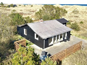 A single-story building with a flat roof, large windows, and a deck area. - Spacious Holiday Home in Strøby near Beach (Aalbaek)