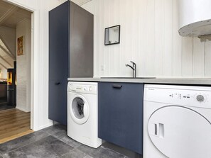 A compact laundry area with a washing machine, a dryer, and a dishwasher.