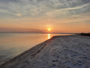 A beach at sunset with a calm sea and a clear sky. - 5 Star Holiday Home in Sydals (Sydals)
