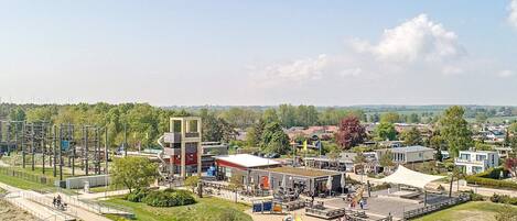 A park with a playground, picnic areas, and a large open space for gatherings.