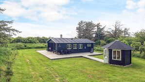 A modern house with a deck and a small attached structure. - Lovely Holiday Home in LÃ¸nstrup near Sea (Hjørring)