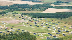 A rural community with houses arranged in a grid pattern, surrounded by fields and forests. - 4 Star Holiday Home in Brovst (Brovst)