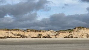A beach with a sandy shore and a dune. - 4 Star Holiday Home in Blavand (Blavand)