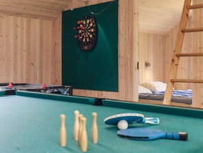 A room with a dartboard, billiards table, and a ladder. - Attractive Holiday Home in Vaggerlose near Sea (Idestrup)