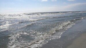 A beach with waves and a clear sky. - 4 Star Holiday Home in Hals (Hals)