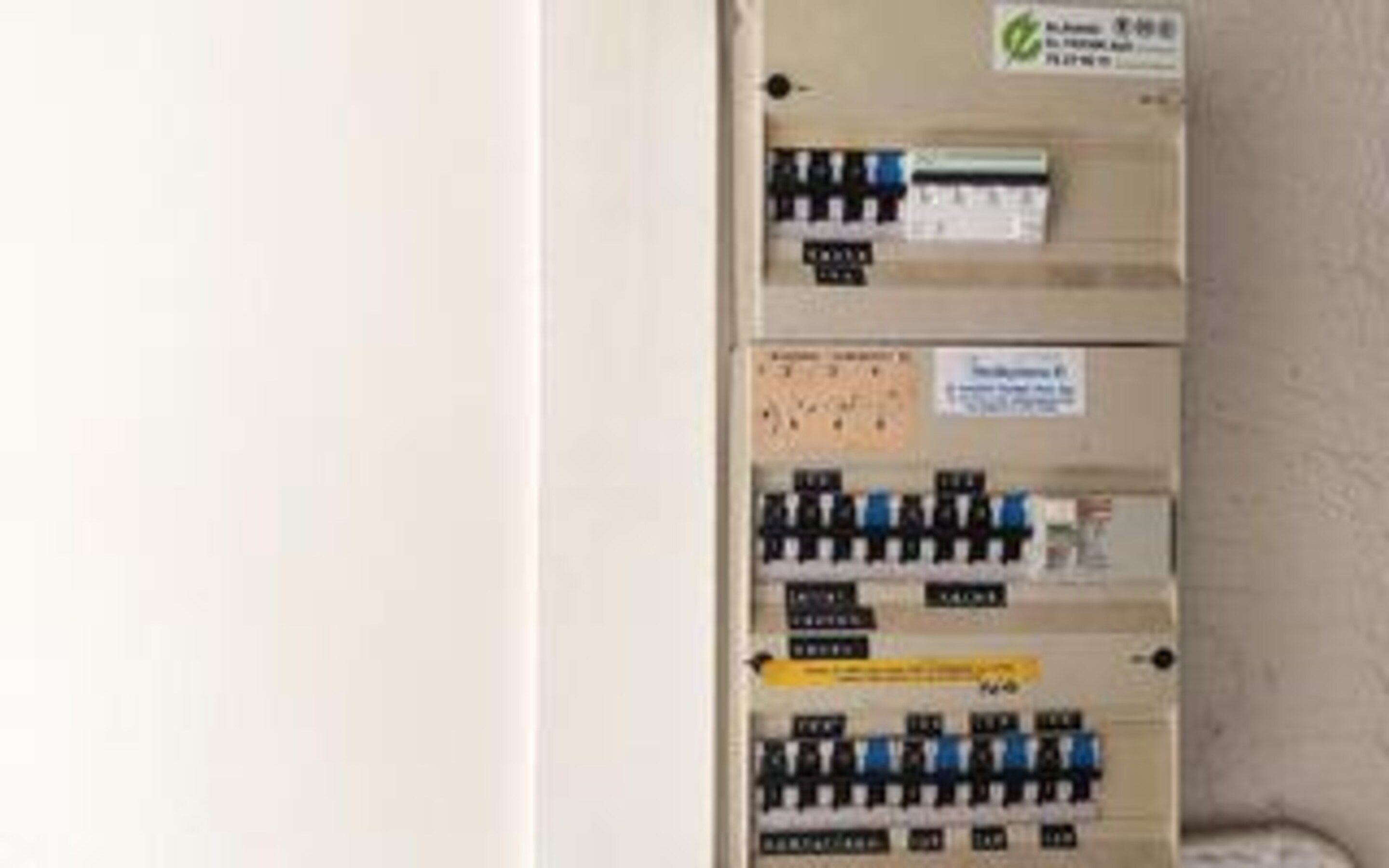 A utility panel with multiple switches and labels, likely for electrical control.