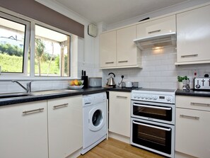 Oven, high chair, cookware/dishes/utensils, freezer