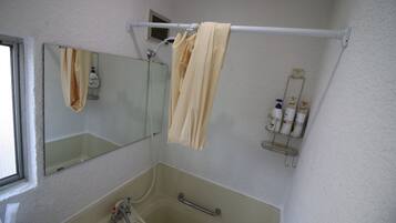 Combined shower/tub, free toiletries, hair dryer, slippers