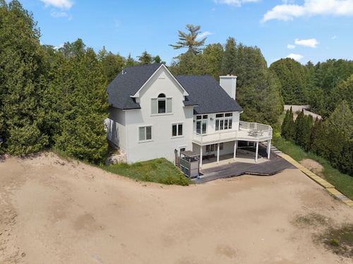 Stunning Lakefront with private sand beach- boardwalk to water!