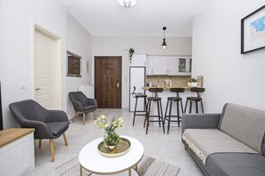 Apartment, 2 Bedrooms | Living area | 50-inch Smart TV with satellite channels, TV