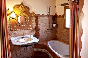 Bathtub, hair dryer, towels, soap