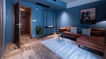 Blue and Peach Two Bedroom Apartment Free Parking | Living area | 42-inch flat-screen TV with satellite channels, LED TV, Netflix