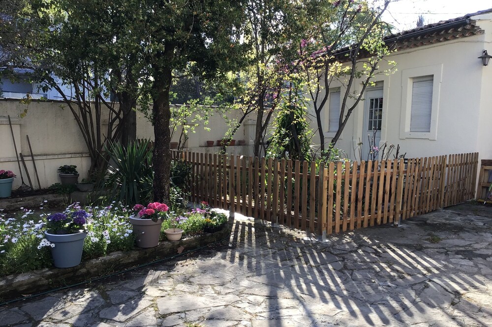 Small flowered house with private garden near town center