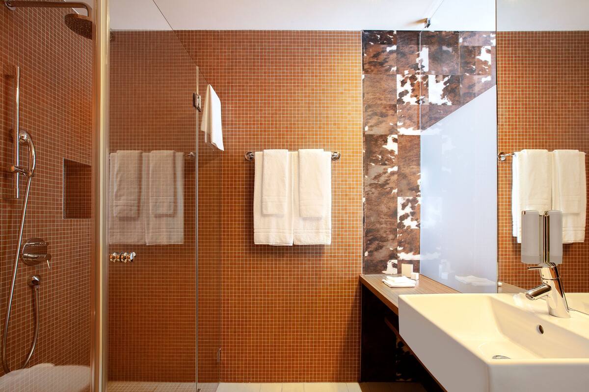 eco-friendly toiletries, hair dryer, bathrobes, slippers