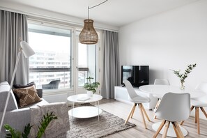 Deluxe Apartment | Living room | Flat-screen TV