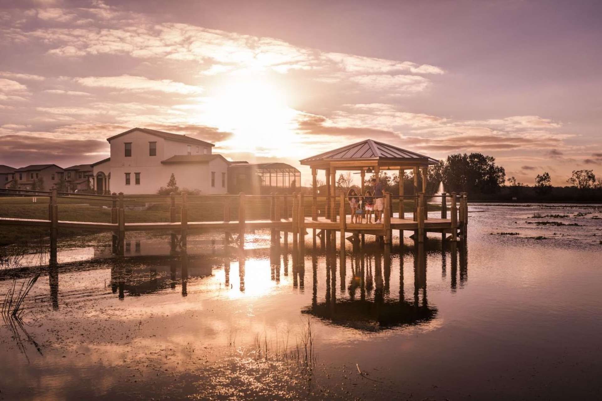 A waterfront property with a house and a gazebo.