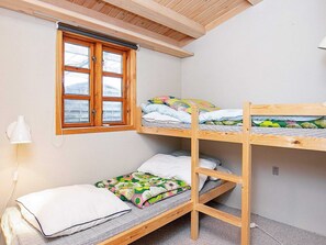 A bunk bed room with a window, a lamp, and a power outlet. - 6 Person Holiday Home in Frorup (Frørup)