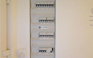 A wall-mounted electrical panel with multiple switches and outlets. - 5 Star Holiday Home in Harboore (Harboore)