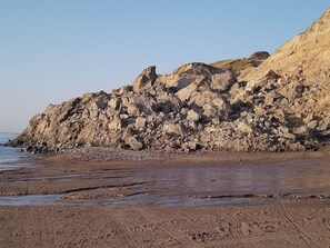 A rocky coastline with a clear sky. - 6 Person Holiday Home in Lokken (Lokken)