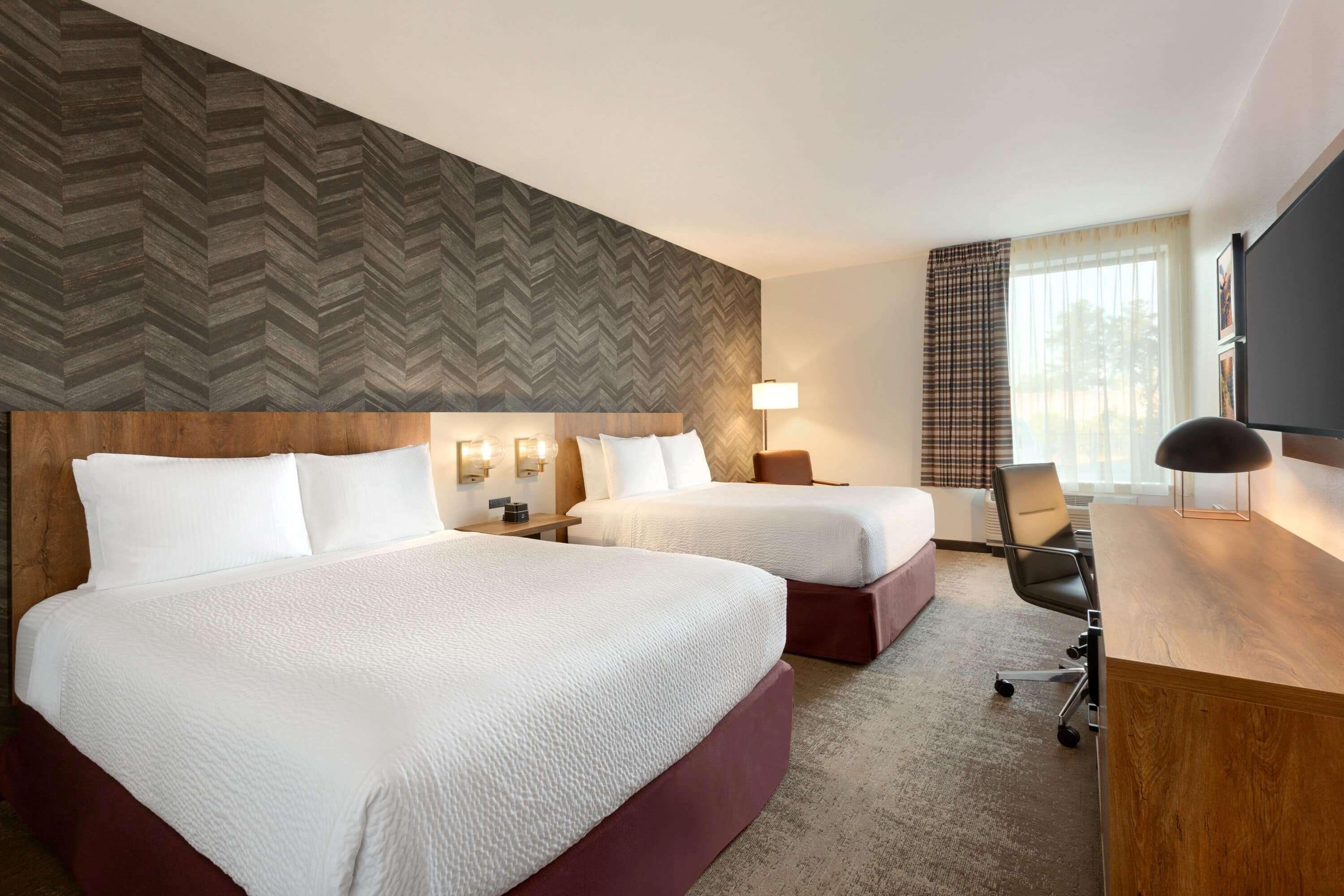 hypo-allergenic bedding, pillow-top beds, desk, laptop workspace